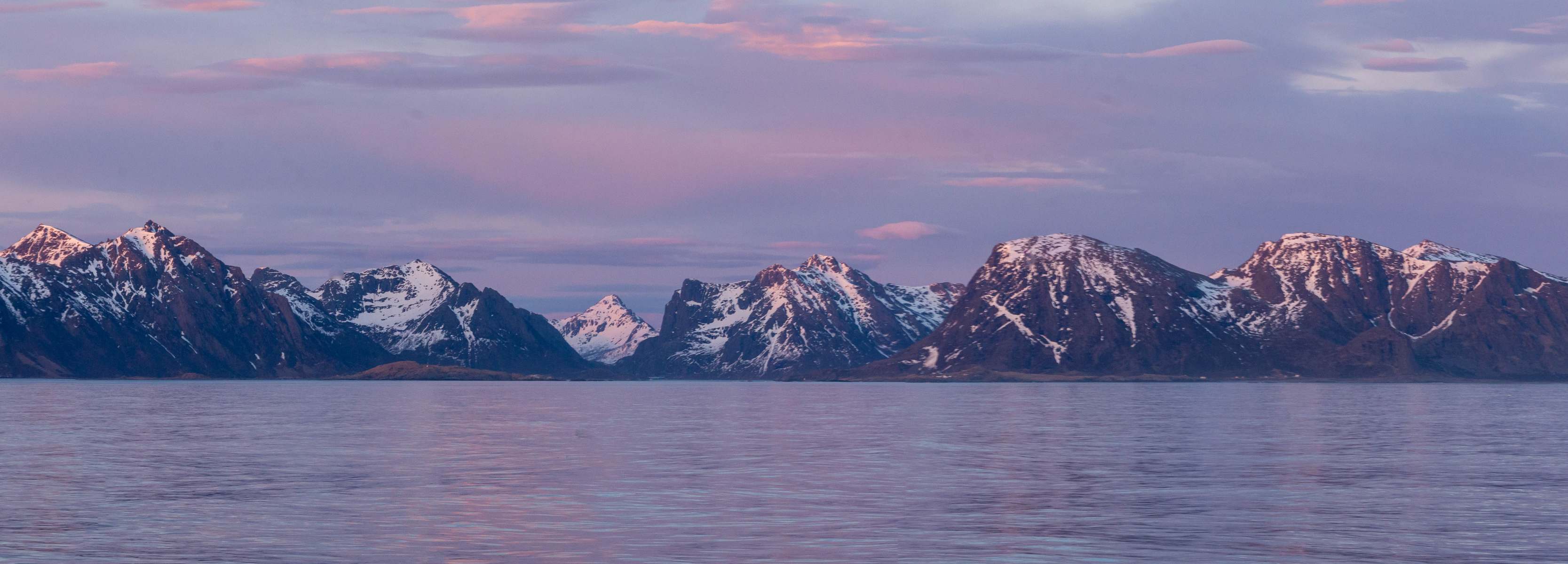 Mountains and fjord in sunset in the dusk